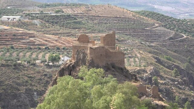 Andalusian old castle at the foothills of Sierra Nevada mountain range in Lanjaron village, Alpujarra, Andalucia, Spain. High quality 4k footage