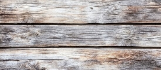 Fototapeta premium Horizontal close-up of weathered wooden boards in light brown and gray tones, ideal for text overlay and design, creating a rustic backdrop.
