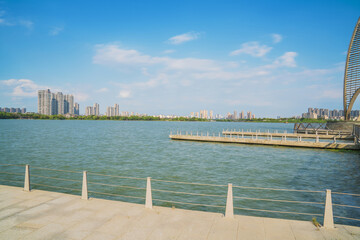 Fototapeta premium The skyline of modern urban buildings and the scenery of the Taihu Lake Lake in Wuxi, Jiangsu Province, China will be built on April 1, 2024