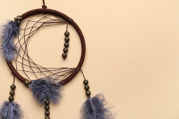 Beautiful dream catcher on beige background