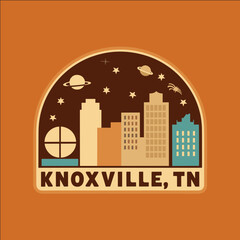 A colorful sticker of a city with a globe in the middle and the words Knoxville, TN