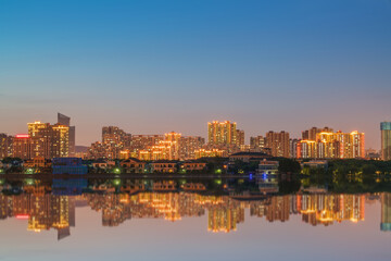 Obraz premium The skyline of modern urban buildings and the scenery of the Taihu Lake Lake in Wuxi, Jiangsu Province, China will be built on April 1, 2024