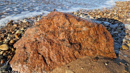 Rough Textured Boulder on Sandy Beach