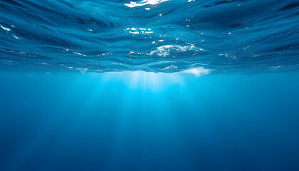 Obraz premium A dramatic underwater view of the deep blue sea during a storm, with abstract blurred waves and dynamic motion, evoking intensity and mystery