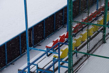 Naklejka premium empty stadium in winter storm