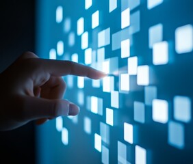 Hand interacting with a glowing digital interface.
