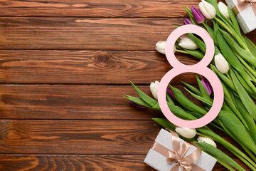 Figure 8 with gift boxes and beautiful tulips on wooden background. International Women's Day