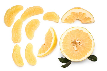 Cut fresh pomelo fruit and leaves on white background