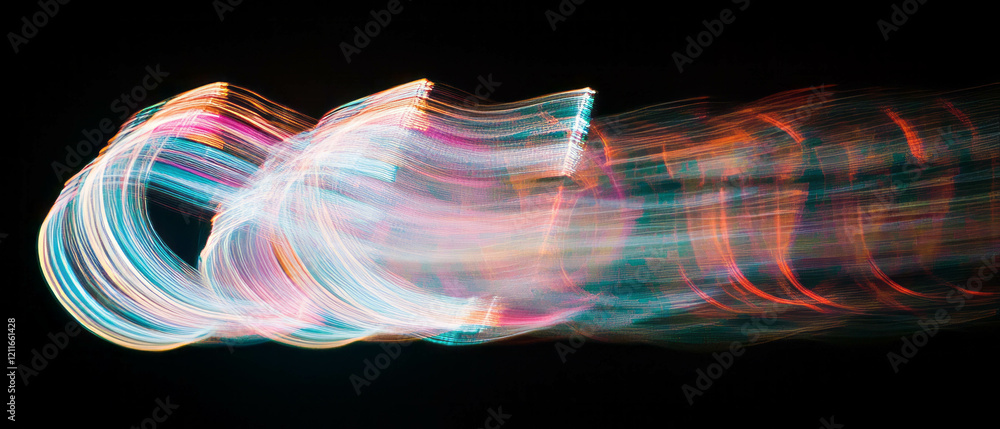 Poster Vivid rainbow light trails create dynamic patterns against a dark backdrop