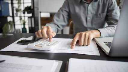 Business man accountant financial analyst and auditor working and laptop for calculating 