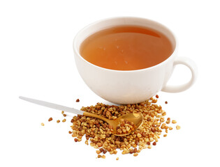 Cup of fresh buckwheat tea and spoon on white background