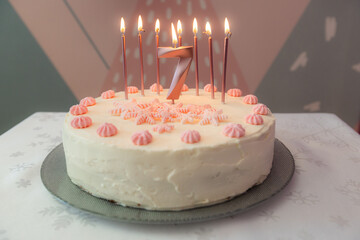 Birthday cake with pink decoration for 7 years
