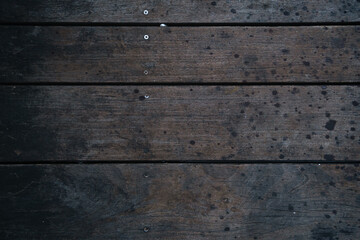 Top view of dark brown wooden textured walk path. Perfect for graphic resource, background or wallpaper