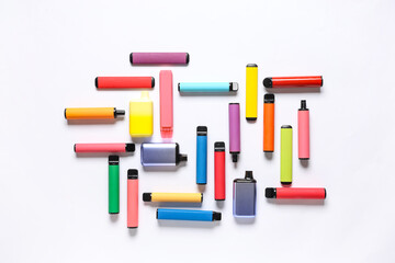 Different electronic cigarettes on white background