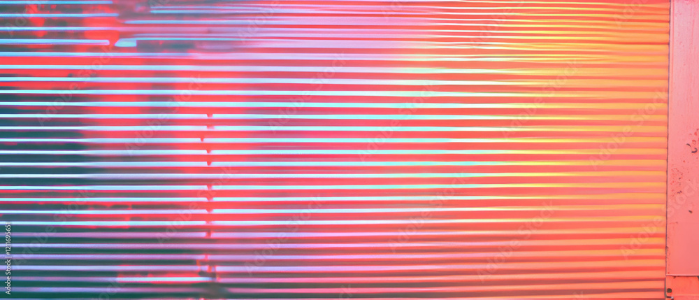 Poster corrugated aluminum texture illuminated by vibrant chasing neon lights in dynamic display