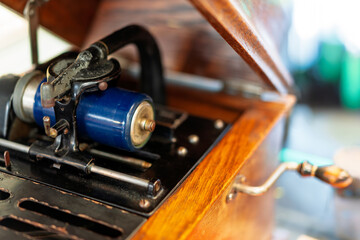 Interior view of vintage phonograph mechanism with roll