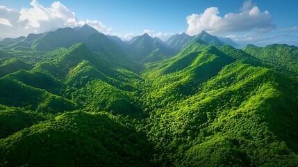 Lush Green Mountain Range Under Bright Blue Sky and Fluffy Clouds