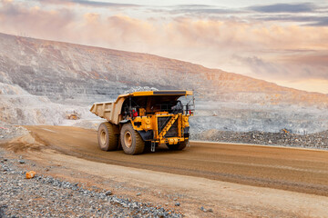 Banner open pit mine industry, big yellow mining truck for gold ore.