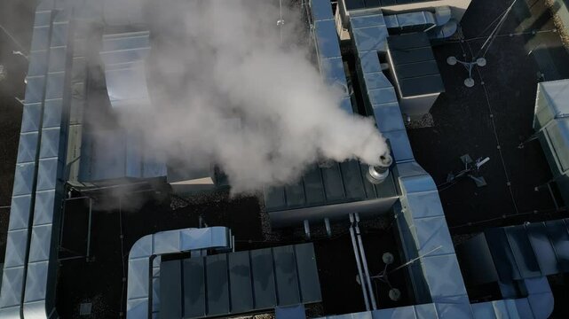 cooling units are industrial or air-conditioning, which are used in the summer for cooling premises, with fans on roof of the storage hall, mainly for industrial operations, high angle view, lawn
