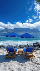 Beach loungers and umbrellas set up on a sandy coastline resembling Tenerife, vacation setting