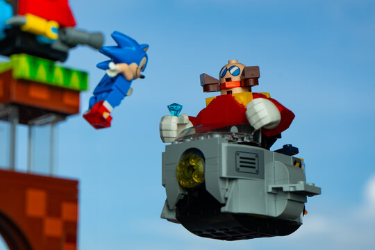 Depok, Indonesia - January 12, 2025: Lego toys photography, lego sonic the hedgehog on green hill zone, with sonic minifigure facing dr. eggman, blue sky background
