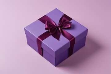 Obraz premium purple gift box with a purple ribbon and a bow on a pink background