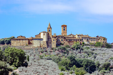 Fototapeta premium Collemancio, a historic hamlet in Cannara, Umbria, showcases its medieval architecture against a backdrop of rolling hills and olive groves. Village Collemancio - Italian national heritage
