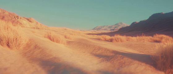 Naklejka premium Golden sand dunes with windblown patterns under a clear blue sky during sunset