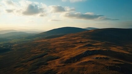 Naklejka premium Golden hour aerial view of rolling hills, landscape photography, nature background, travel, scenic