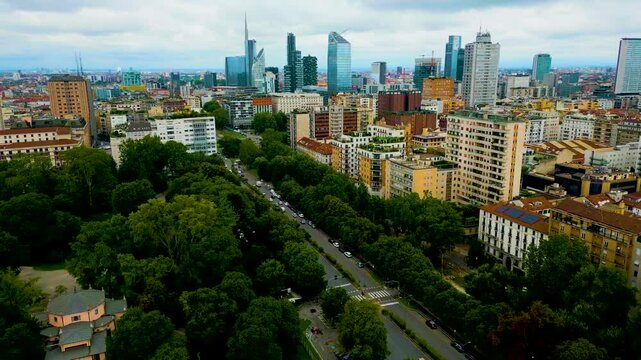 4K Aerial Drone Video of Apartment Buildings and Skyscrapers near Indro Montanelli Garden Park in Milan, Italy on a Summer Day