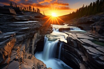 Athabasca falls flowing at sunset in jasper national park, creating a beautiful landscape