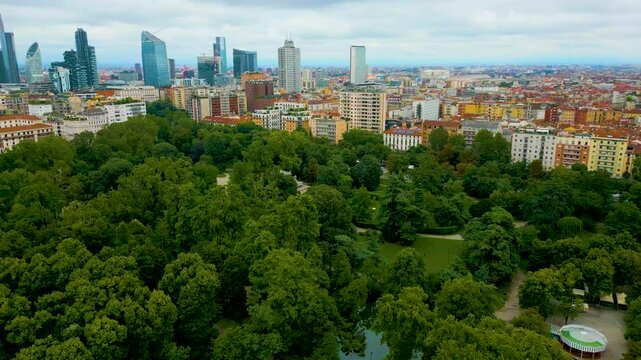 4K Aerial Drone Video of High Rise Apartment Buildings and Modern Skyscrapers near Indro Montanelli Garden Park in Milan, Italy (High Speed)