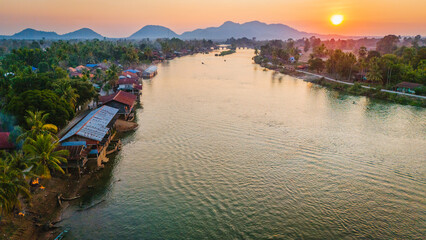 Obraz premium Drone Landscape, establishing at 4000 Islands Laos, Mekong River, reflected below Sunset travel destination south east Asia 