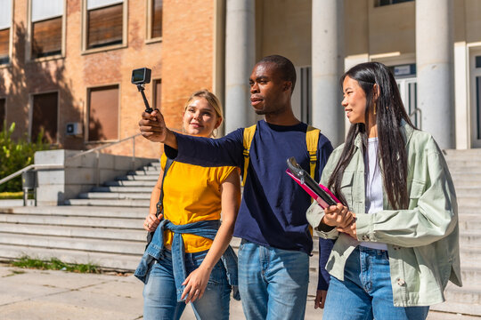 Multi-ethnic university students recording vlog with camera