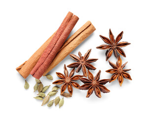 Anise stars with seeds and cinnamon on white background