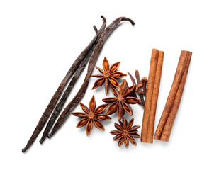Anise stars with cinnamon, cloves and vanilla sticks on white background