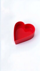 Red heart-shaped container on white background