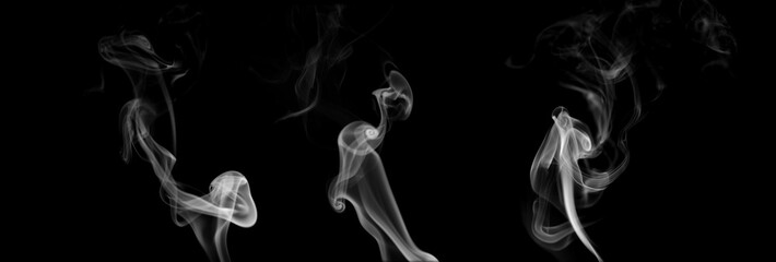 Mysterious smoke billows out, separated from the background, creating an abstract mystical atmosphere as particles of vapor and incense float into the air. Dark grey smoke mixes with mistvapor © loechai