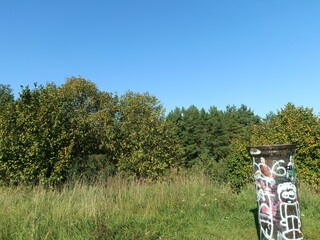 Salduve hill during sunny day. Small hill. Grass is growing on hill. Staircase leading to the top....