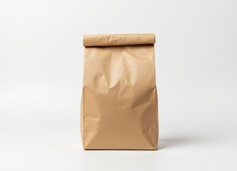 Brown paper bag with folded top on white background