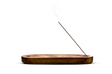 Burning incense stick in a decorative wooden holder isolated from background
