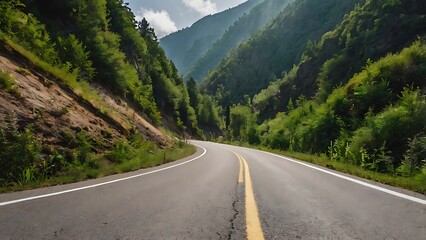 Fototapeta premium A beautiful curvy mountain greenery road 