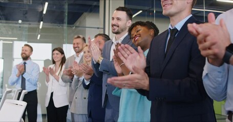 Business team celebrating success, a deal, or a partnership during an office meeting, applauding. People group is united and motivated, recognizing achievements and milestones in work.