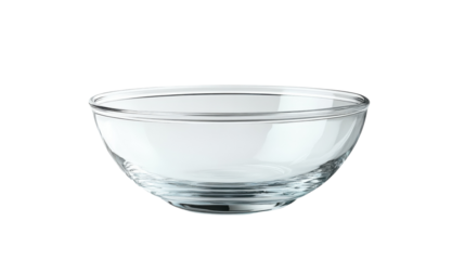 A crystal-clear glass bowl resting elegantly on a minimalistic surface in natural light