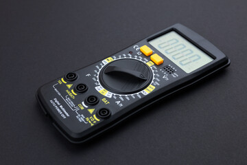 Digital multimeter on dark background