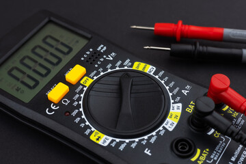 Digital multimeter on dark background