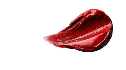 Vibrant red paint elegantly smeared across a white surface, showcasing an artistic expression