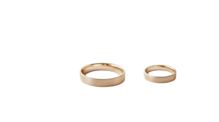 Elegant gold wedding rings symbolizing love and commitment displayed on a simple background
