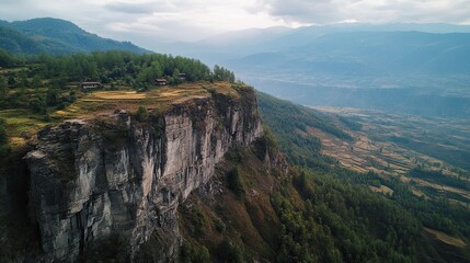 Naklejka premium Mountaintop village, cliffside homes, valley view, rural landscape, travel photography