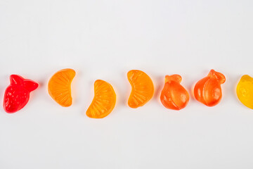 Assorted gummy candies, Juicy colorful jelly sweets. Gummy candies on white background.